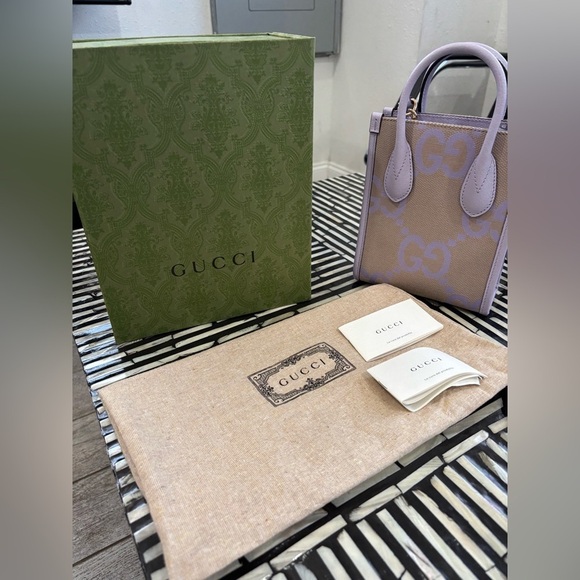 Gucci Handbags - Authentic Gucci Purple and Beige mini jumbo GG canvas CrossbodyRetails$2500